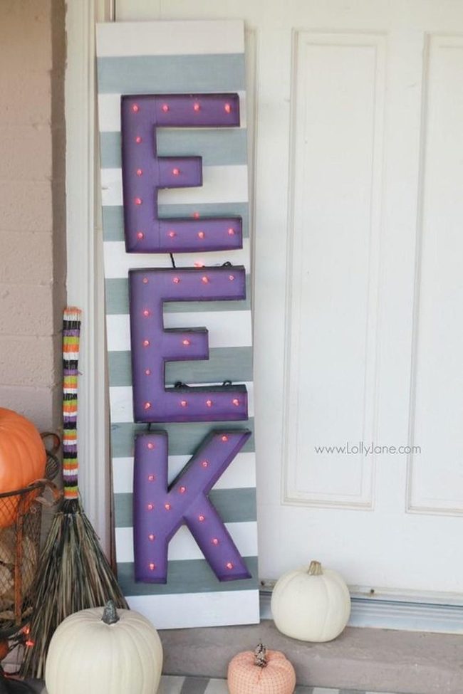 Purple Eek Letters With Glowing Bulbs
