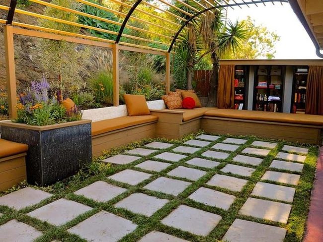 Orange Cushions Among Green Shelves