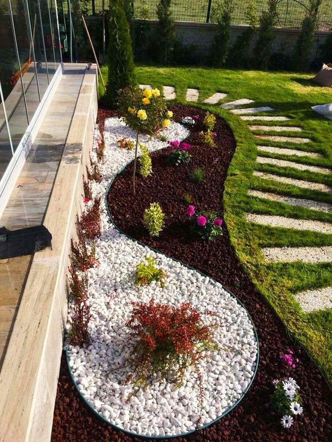 White Pebbles Guide Blooming Garden Path