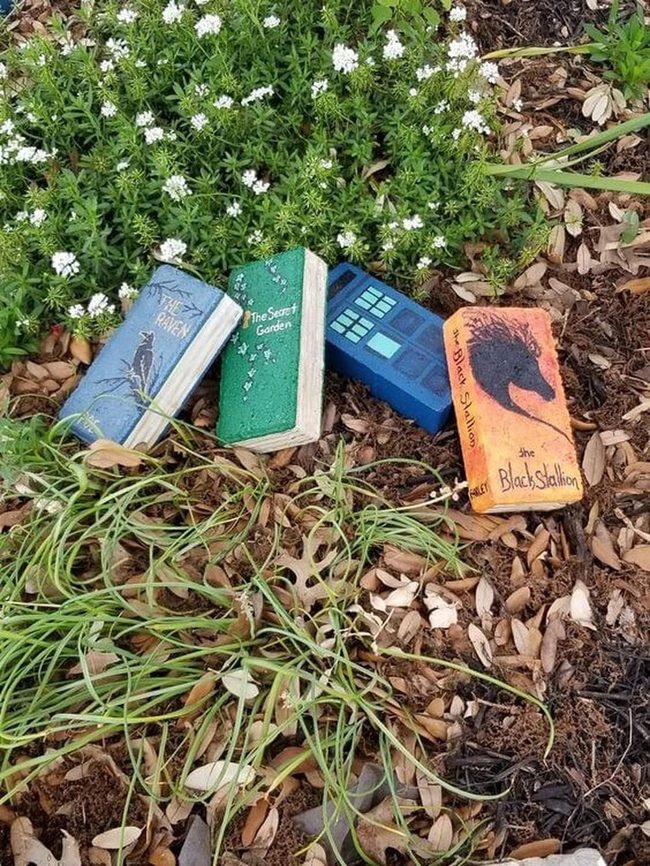 Colorful Books Nestled In Green