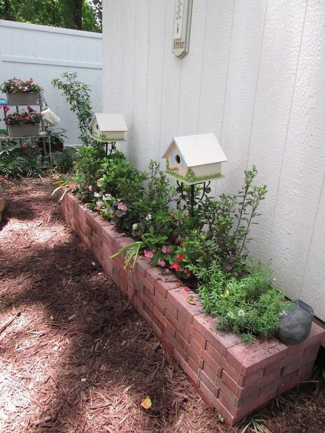 Brick Planters Overflowing With Blooming Flowers