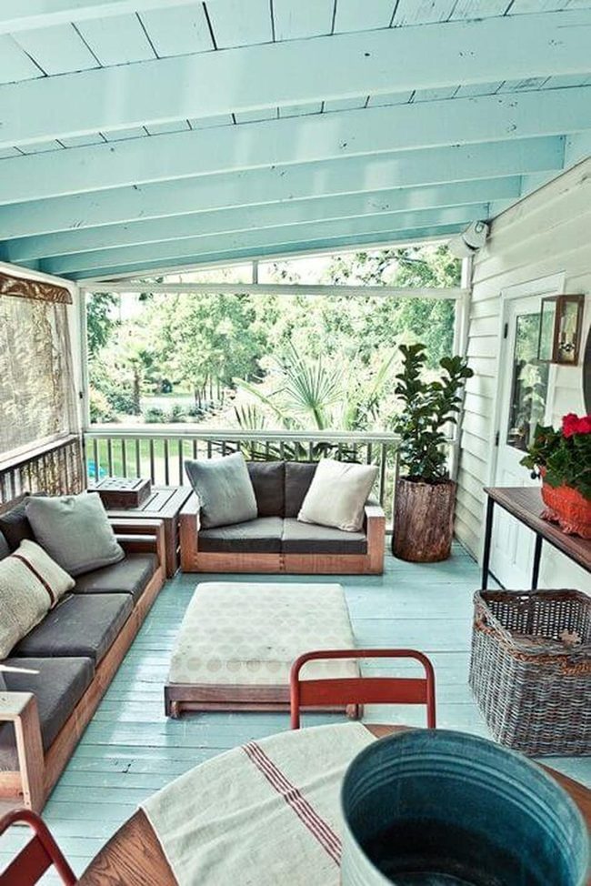 Blue Ceiling Porch With Natural Wood Seating