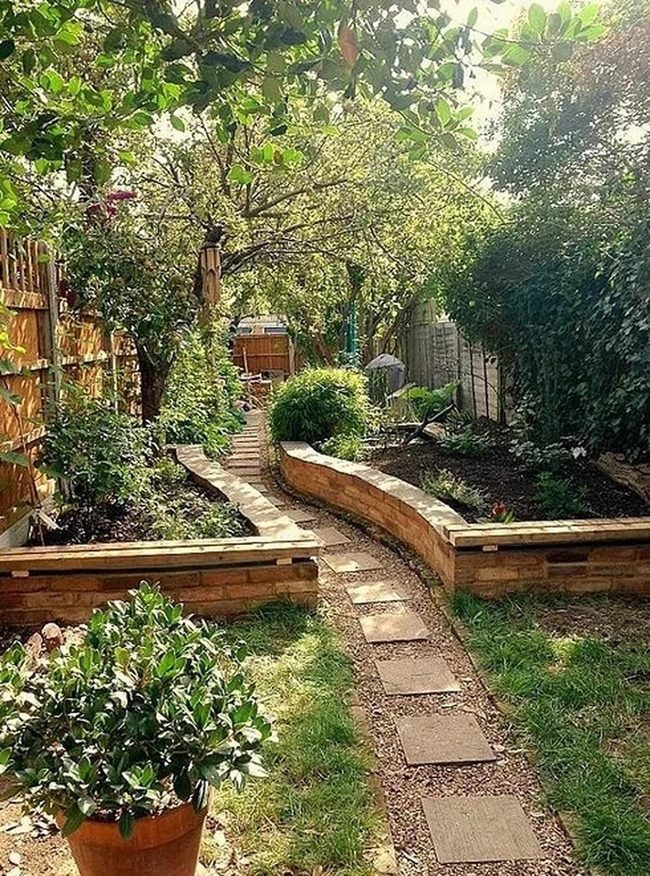 Brick Path Through Flowering Greenery