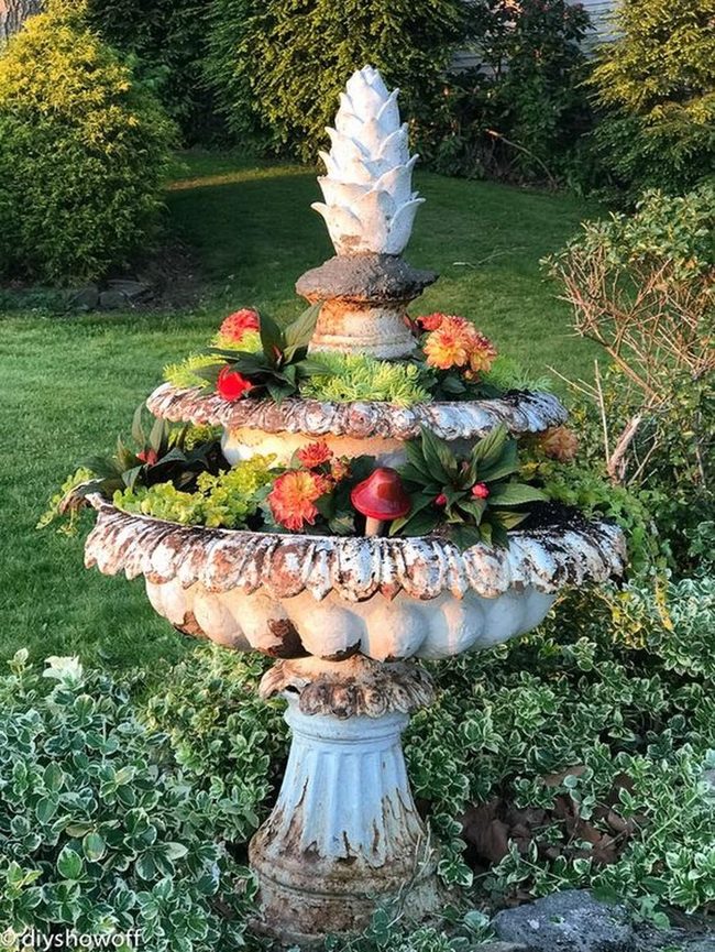 Terracotta Fountain Among Blooming Gardens