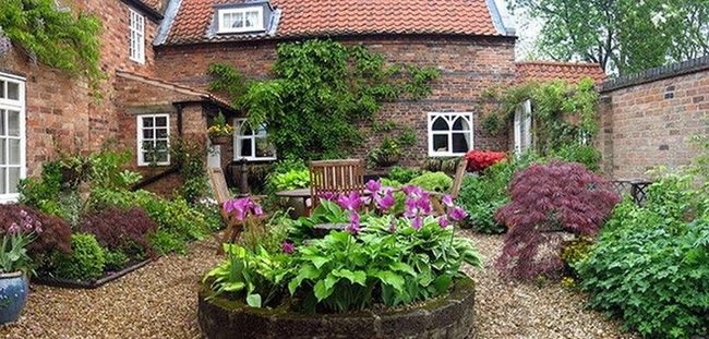 Vintage Courtyard Among Blooming Gardens