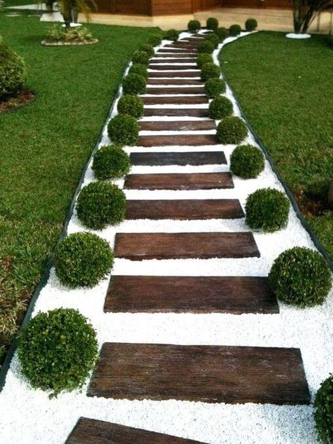 Wooden Path Through Green Landscape