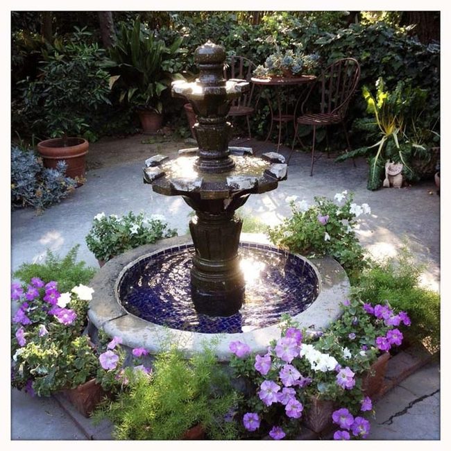Water Fountain With Flowering Garden