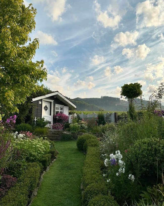 Blooming Garden Pathways With Soft Evening Lights