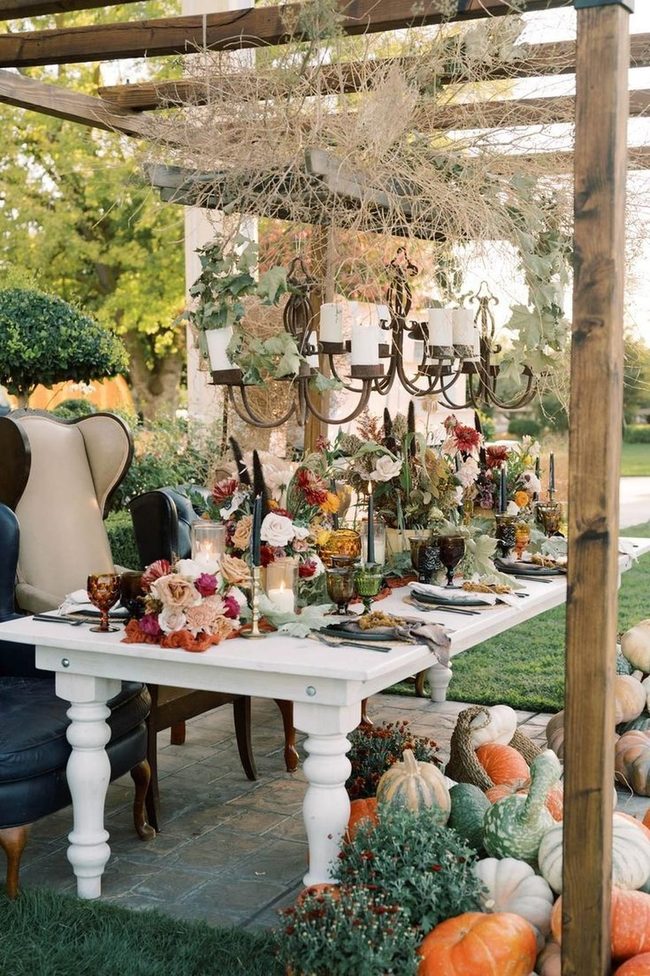 Iron Chandelier Over Stone Dining