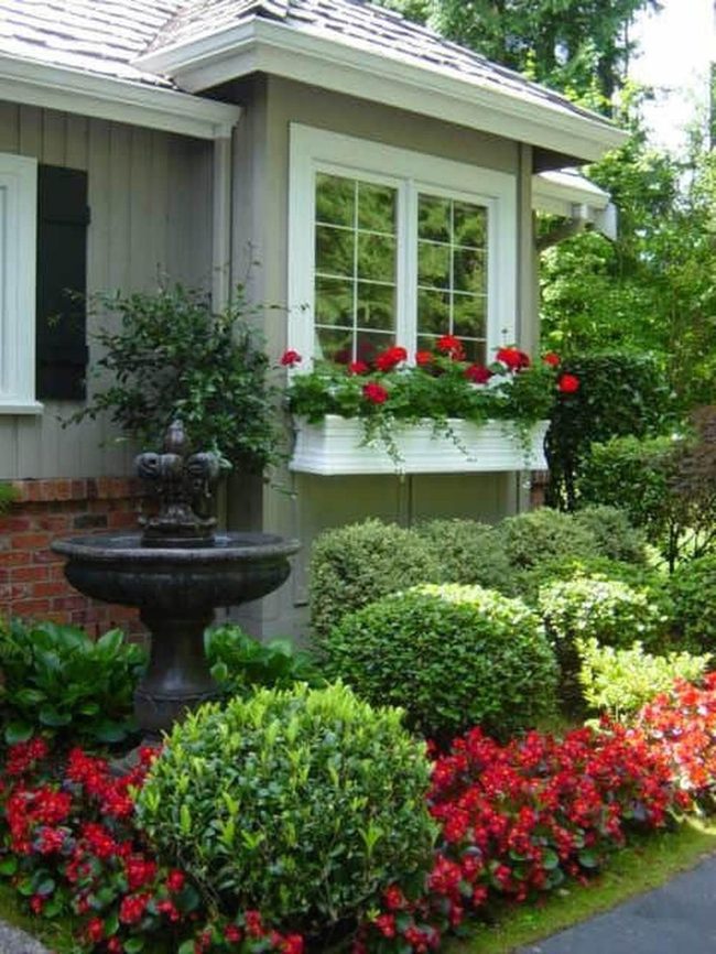 Red Flowers Framing The Garden Entrance