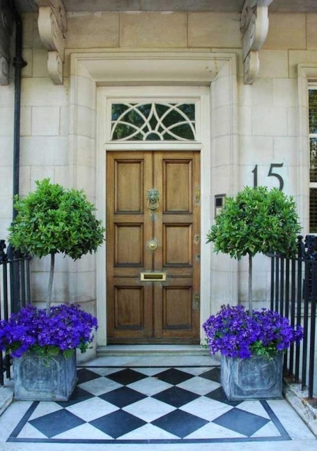 Brass Knocker And Checkered Porch Entry