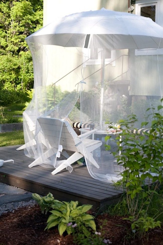 White Chairs On Dark Wooden Deck