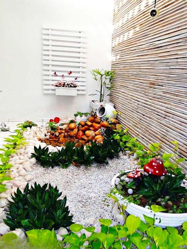 White Stone Garden With Quirky Planters