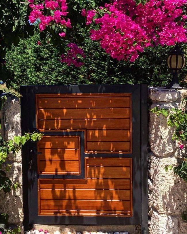 Brown Wood Gate With Geometric Cutouts