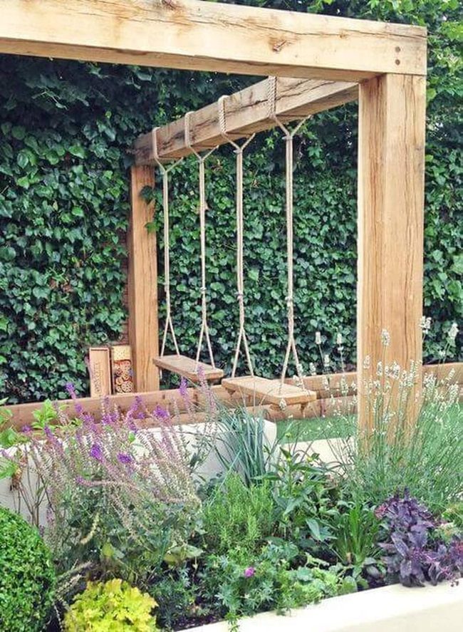 Wooden Swing Among Blooming Gardens