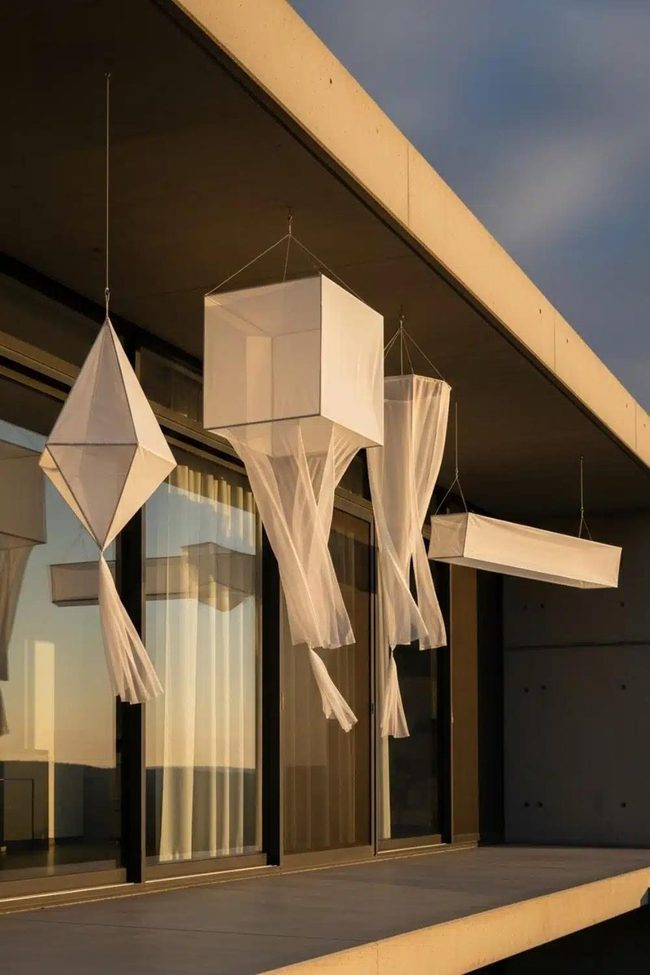 White Geometric Shapes Float Overhead