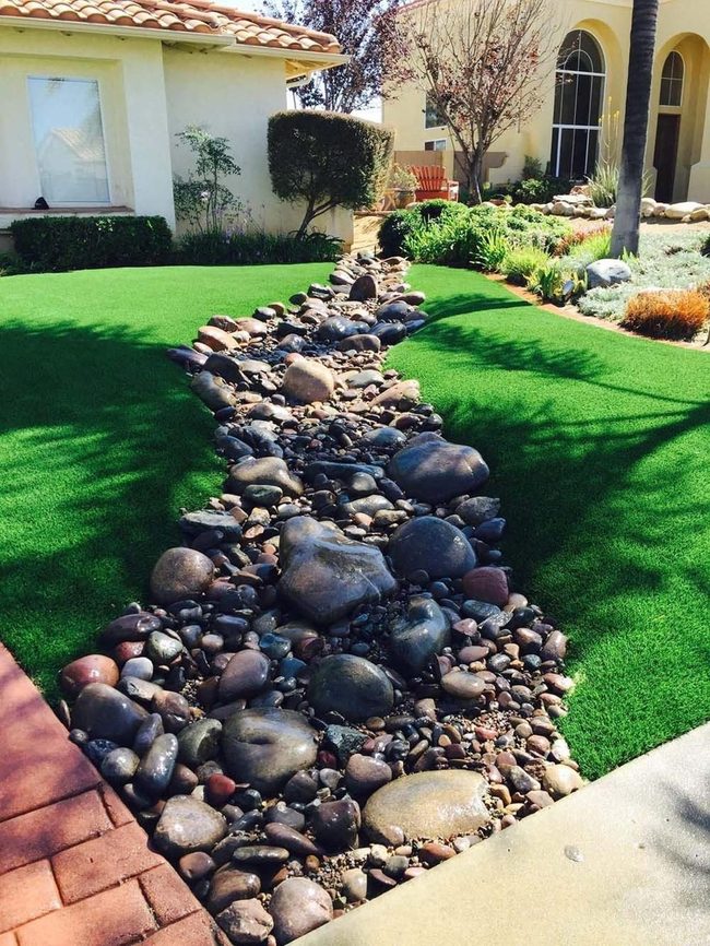 Artificial Grass And Rock Riverbed