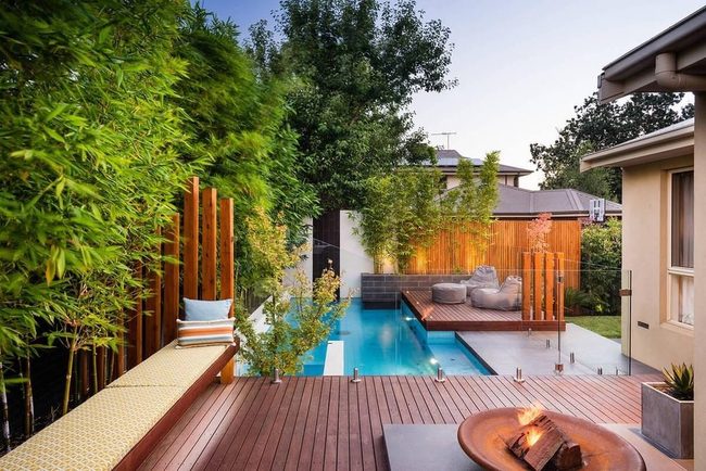 Dark Wood Deck With Modern Fireplace