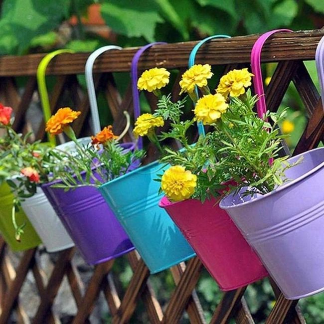 Bright Metal Buckets On Fence