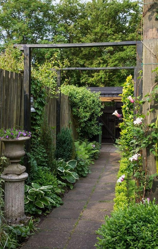 Stone Path Through Shadowed Garden Canopy