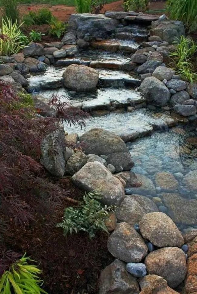 Cascading Water Over Layered Stone