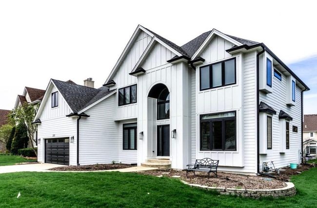 White Siding Black Window Contrast