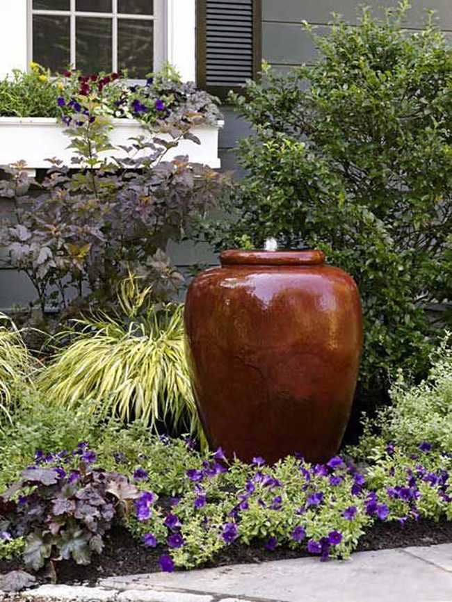 Purple Flowers Against Brown Ceramic Pots