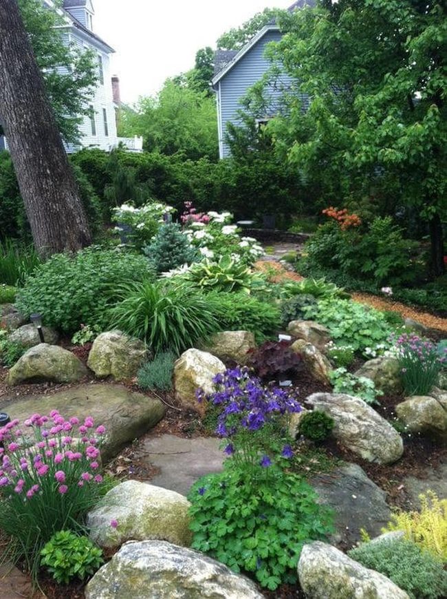 Flowers, Stones, And Layered Green