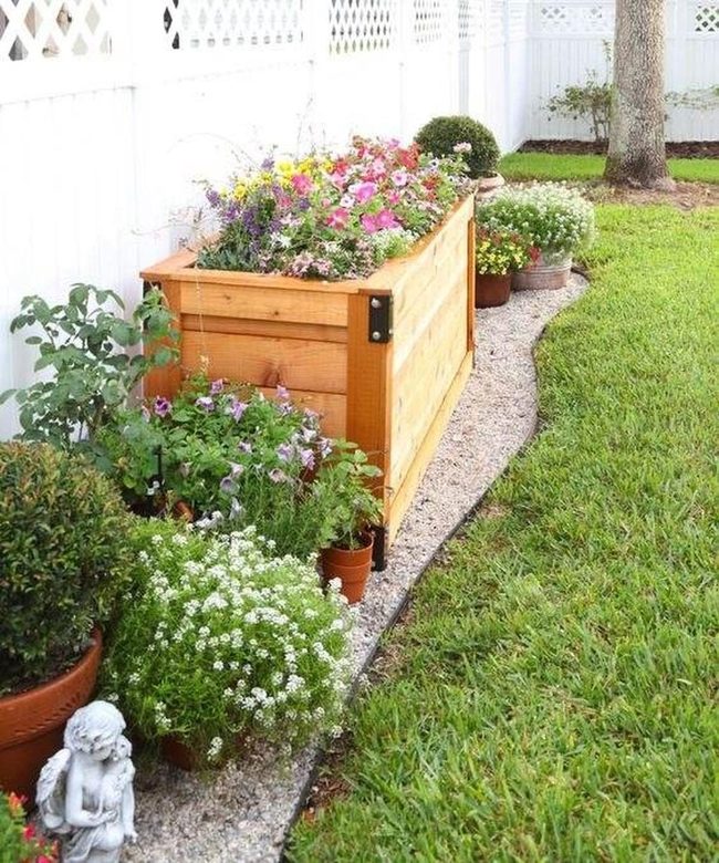Raised Wood Beds With Blooming Herbs