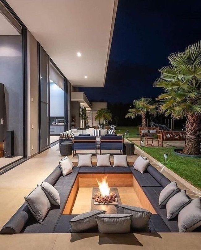 Dark Lounge Firepit With Palm Trees