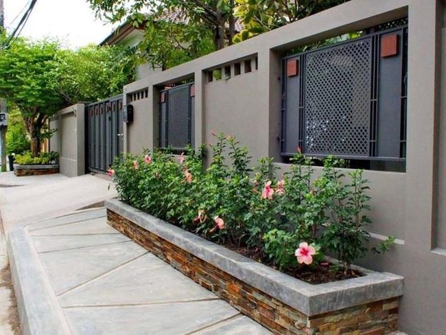 Stone Planters Transform Fence Lines