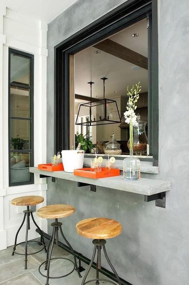 Black-Framed Windows With Wooden Bar Stools