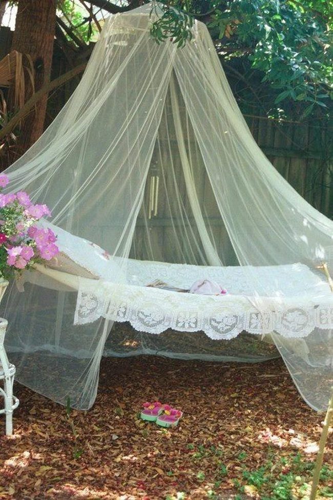 White Lace Hammock Among Pink Blooms