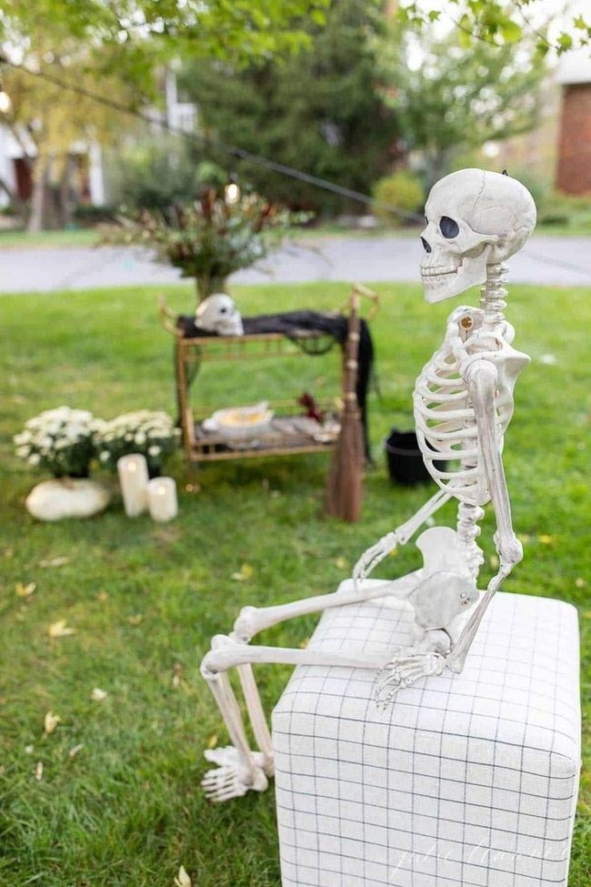 Skeleton On Striped Ottoman