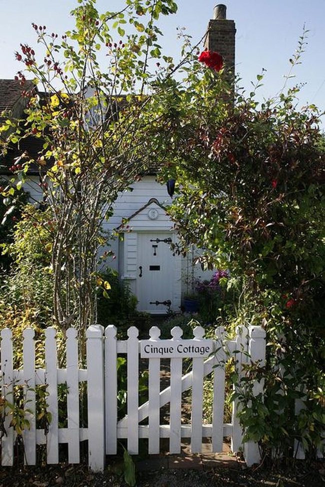 Red Flowers Frame White Cottage Entrance