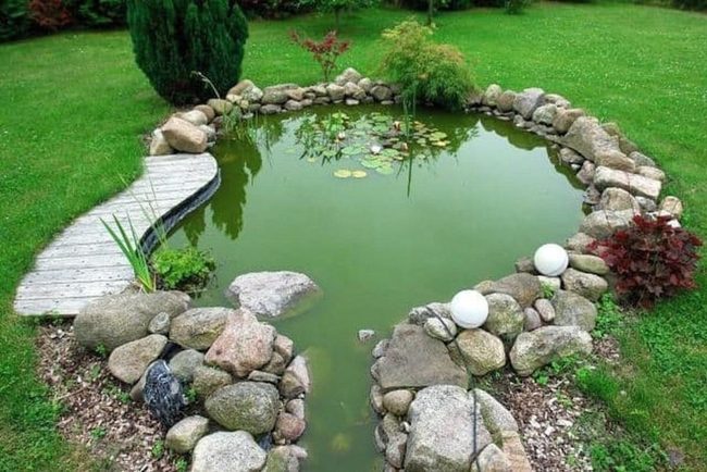 Garden Pond With Smooth Stone Borders