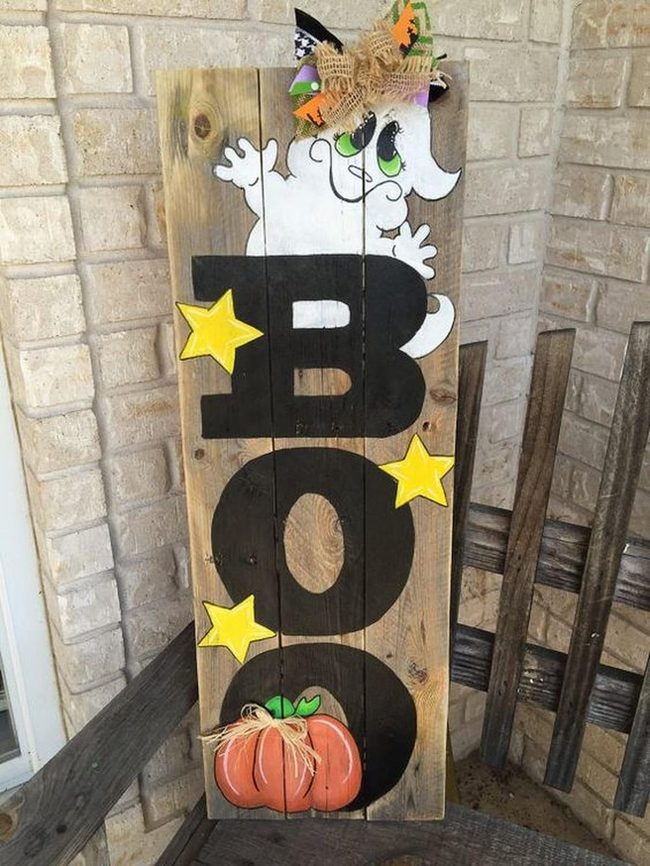 Black Boo On Wooden Planks