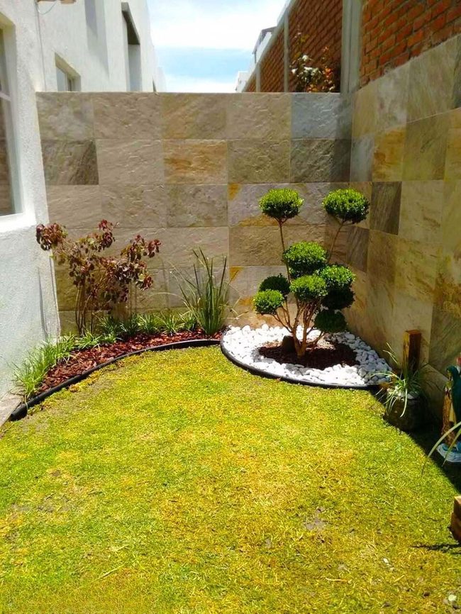 Sculpted Green Forms And White Stones