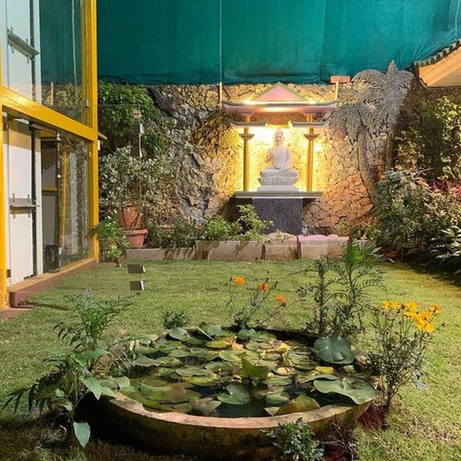 Buddha Statues With Floating Water Lilies