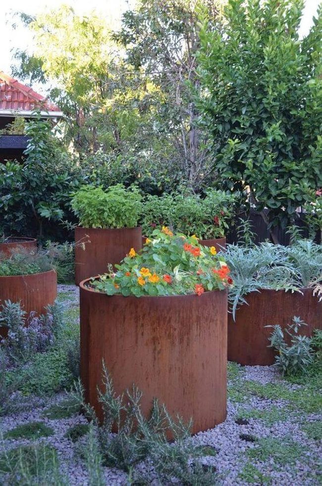Tall Weathered Containers With Spilling Blooms