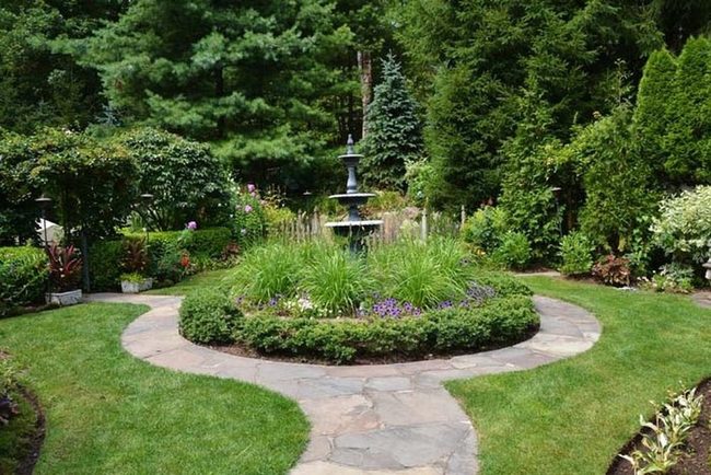 Fountain Framed With Layered Grasses