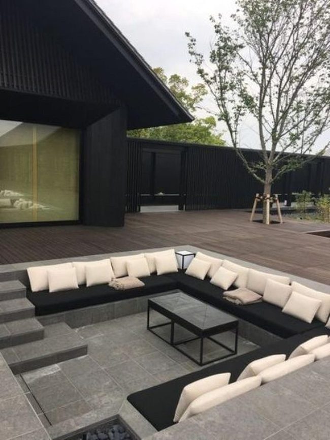 Black Seating With Stone Fire Pit