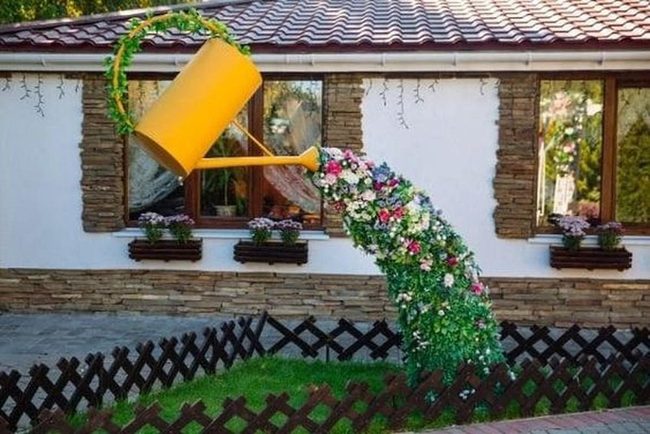 Yellow Watering Can Cascading Blooms