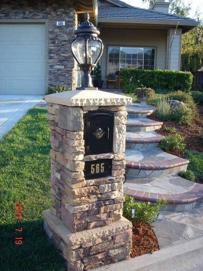 Stone Mailboxes With Evening Lamplight