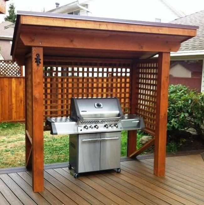 Stainless Steel Grill On Brown Deck
