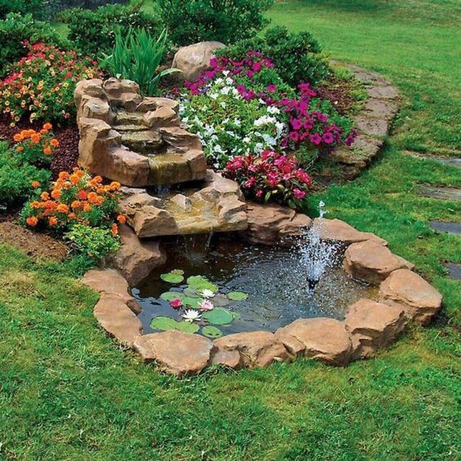 Cascading Water And Blooming Garden Pond