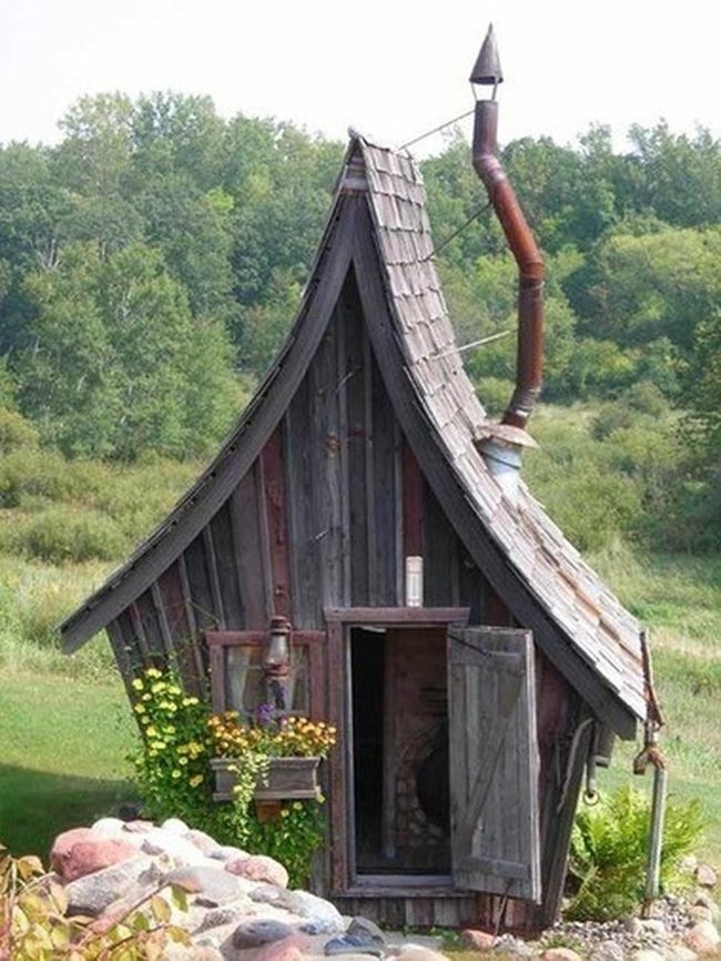 Weathered Cabin With Golden Wildflowers