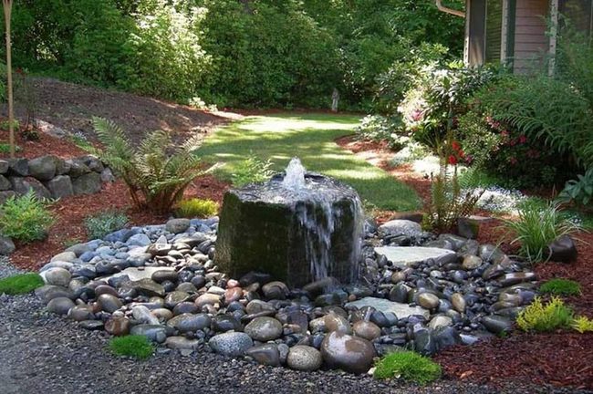 Illuminated Stones With Flowing Water