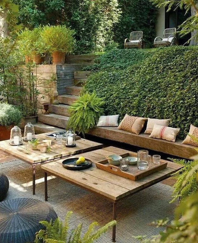 Green Outdoor Retreat With Wooden Seating