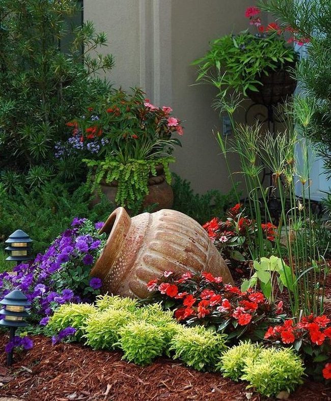 Toppled Terracotta Spilling Red Purple Blooms